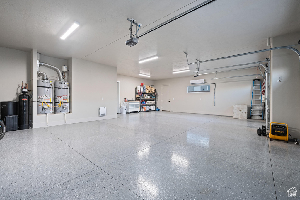 Garage with water heater and a garage door opener