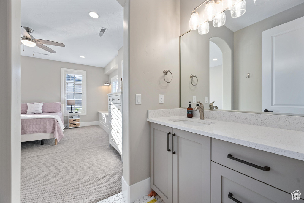 Bathroom with vanity, ceiling fan, connected bathroom, and recessed lighting