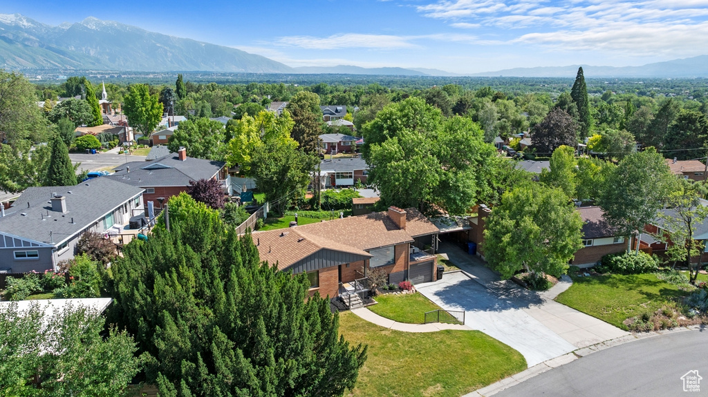 Aerial perspective of suburban area with a mountainous background