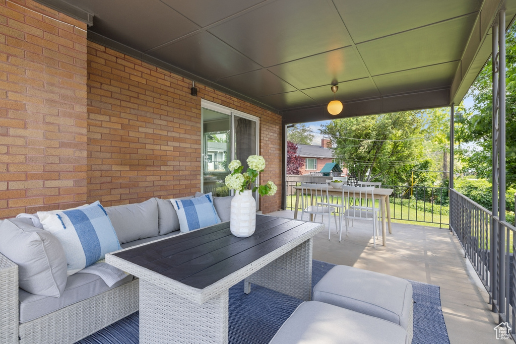 View of patio featuring outdoor dining area and an outdoor living space