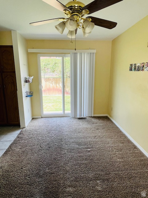 Unfurnished room with light carpet and a ceiling fan