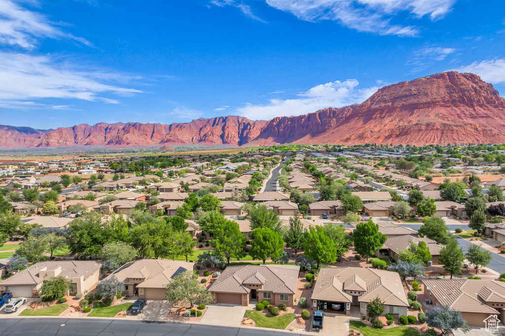 View of mountain backdrop featuring nearby suburban area
