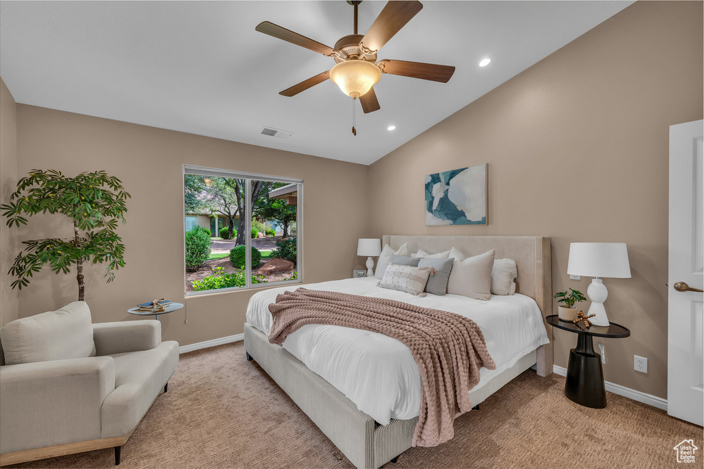 Bedroom featuring light colored carpet, a ceiling fan, recessed lighting, and lofted ceiling