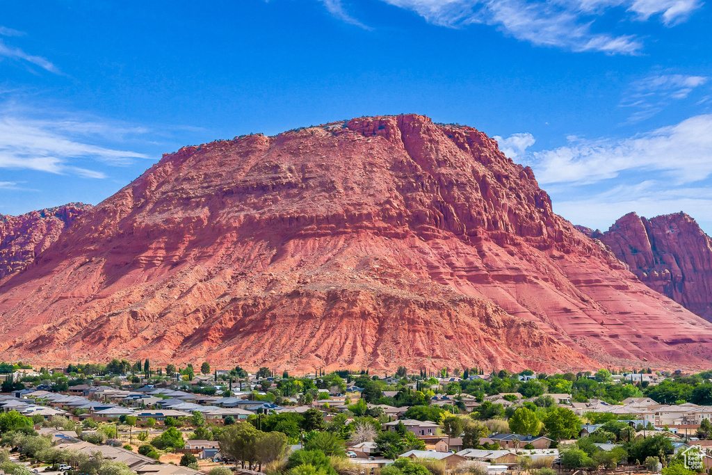 View of mountain backdrop featuring nearby suburban area