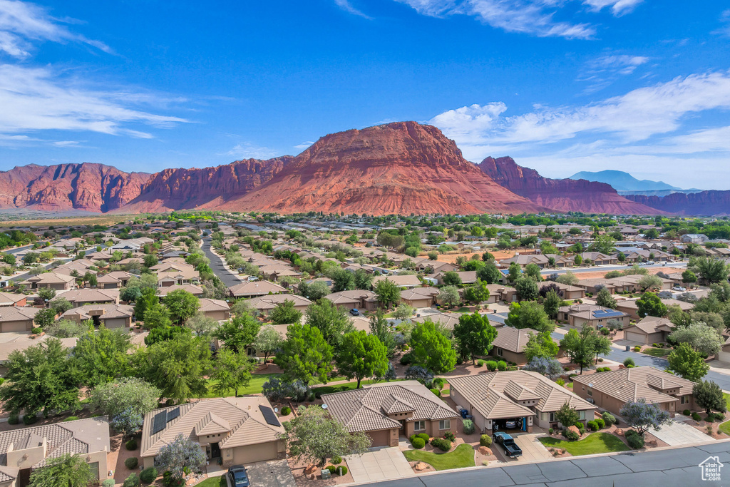 View of mountain backdrop featuring nearby suburban area