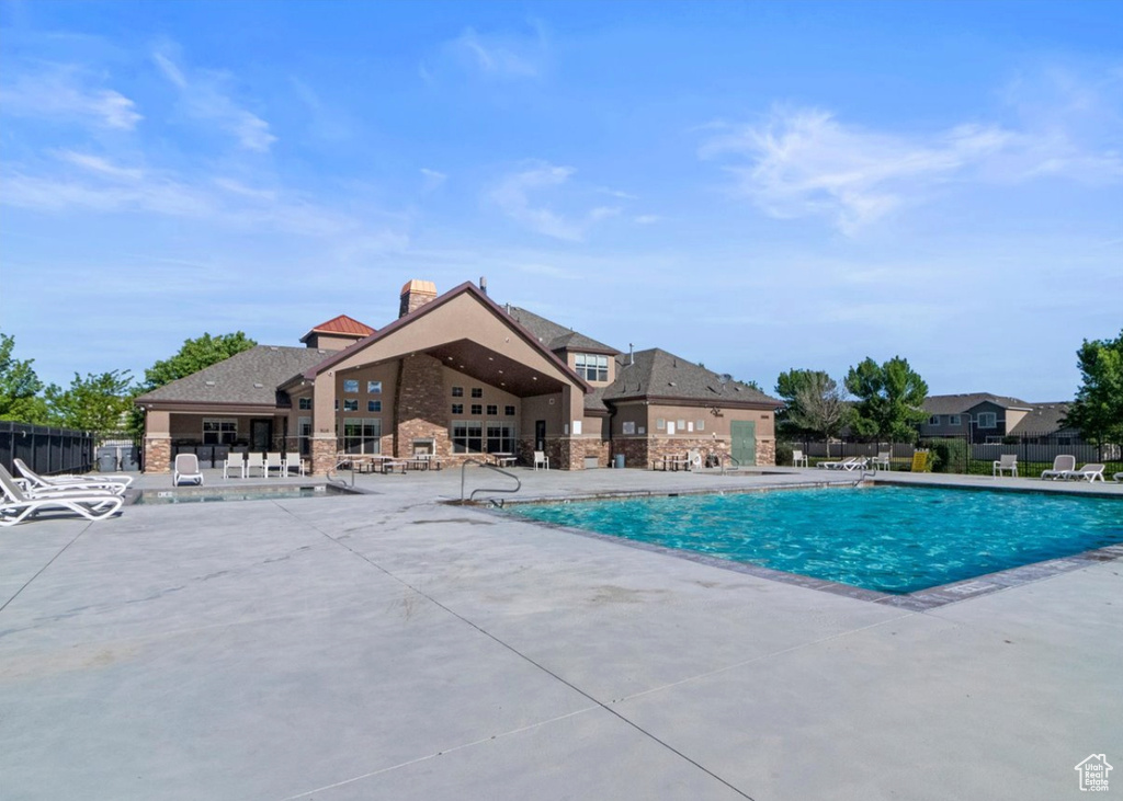 Community pool with a patio area
