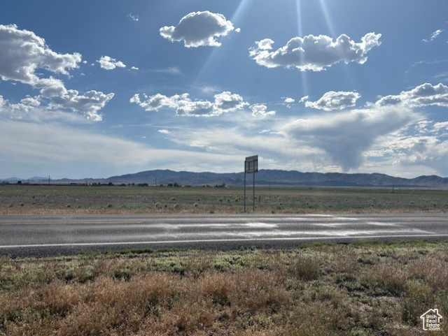 View of mountain backdrop featuring rural landscape