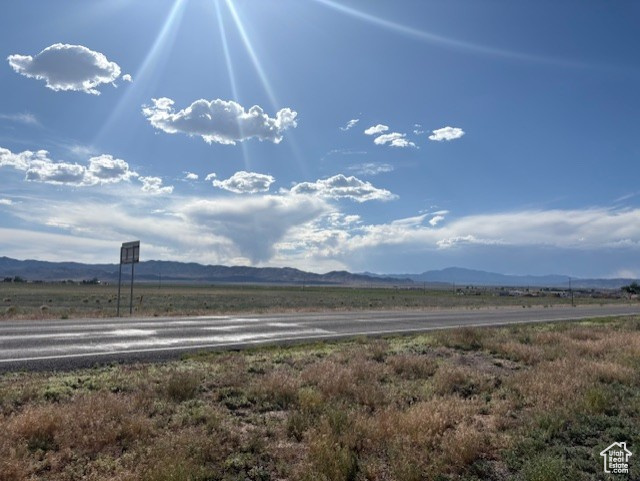 View of mountain background featuring rural landscape