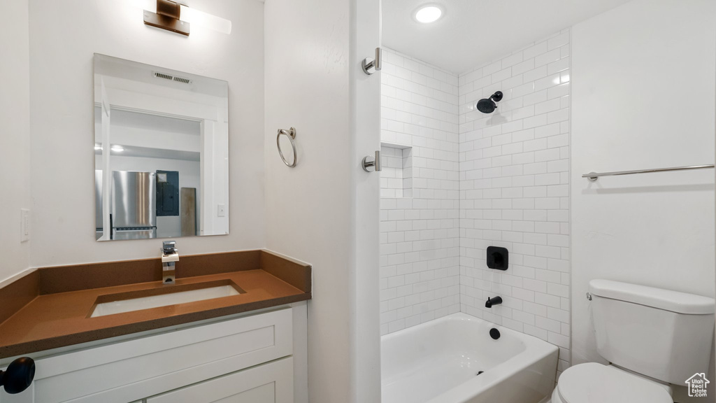 Full bath featuring vanity and bathing tub / shower combination