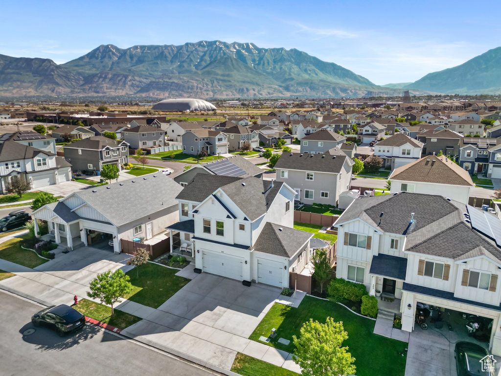 Aerial view of residential area featuring a mountain backdrop