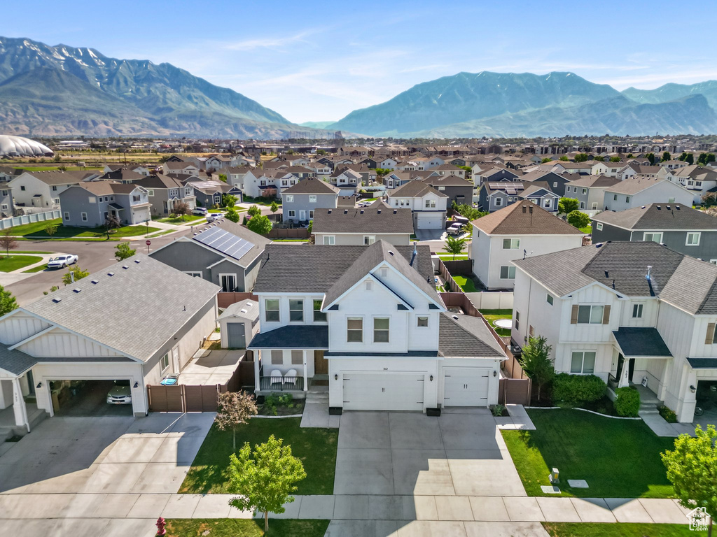 Aerial perspective of suburban area with a mountain backdrop