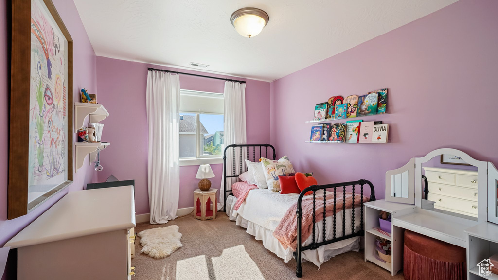 Carpeted bedroom featuring baseboards