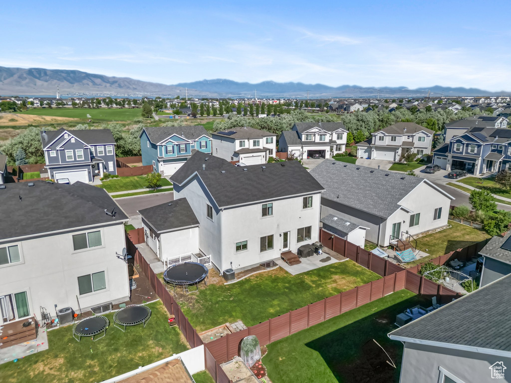Aerial view of residential area with a mountainous background