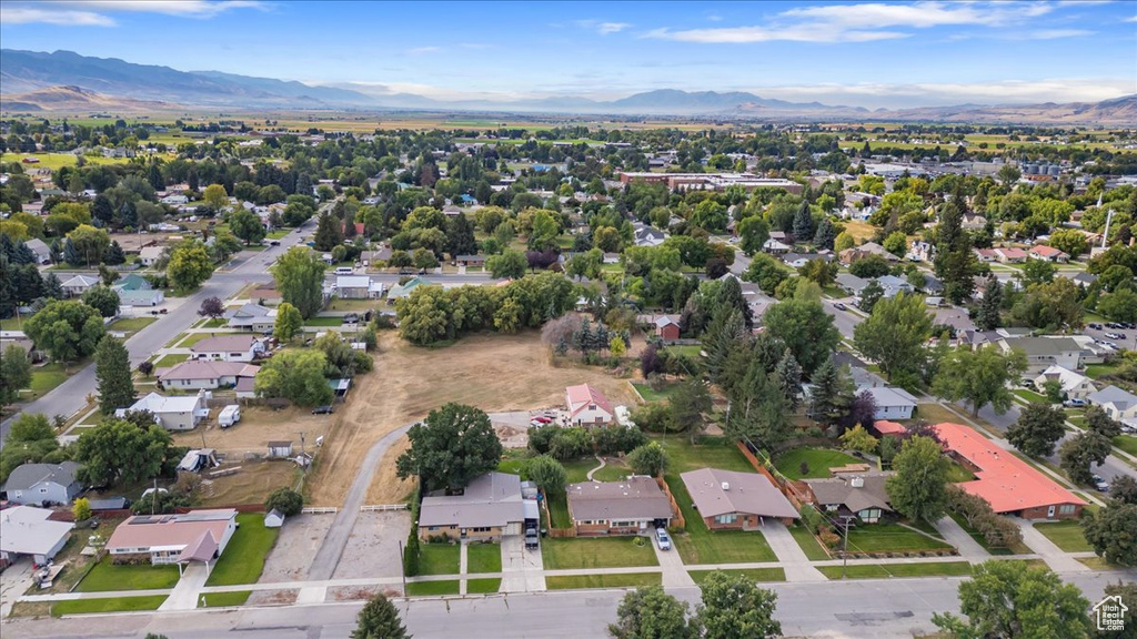 View of property location featuring a mountain backdrop and nearby suburban area