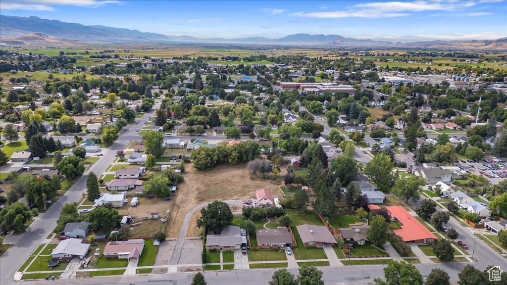 View of property location with a mountainous background and nearby suburban area