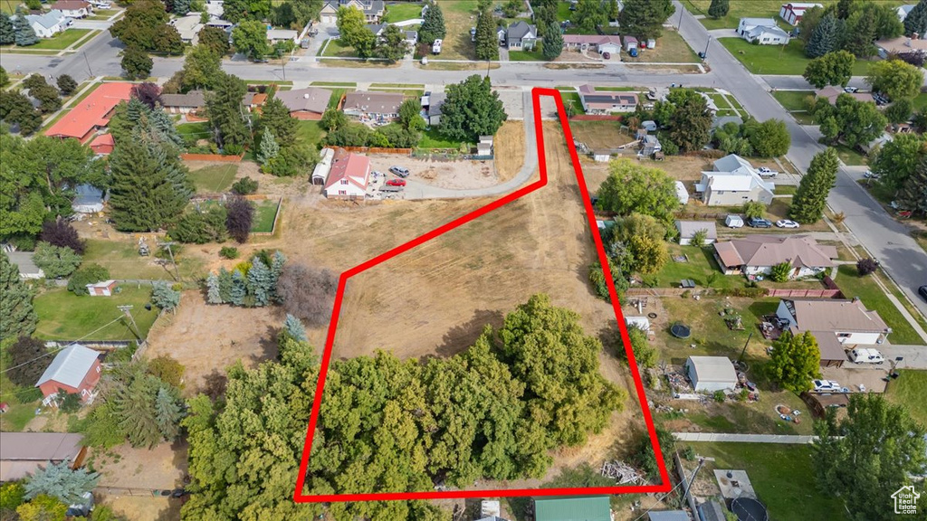 Aerial overview of property's location featuring nearby suburban area and property boundaries highlighted
