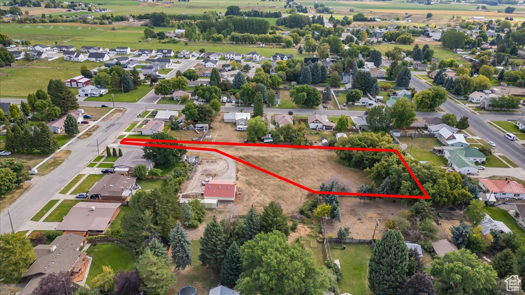 Aerial perspective of suburban area featuring property parcel outlined