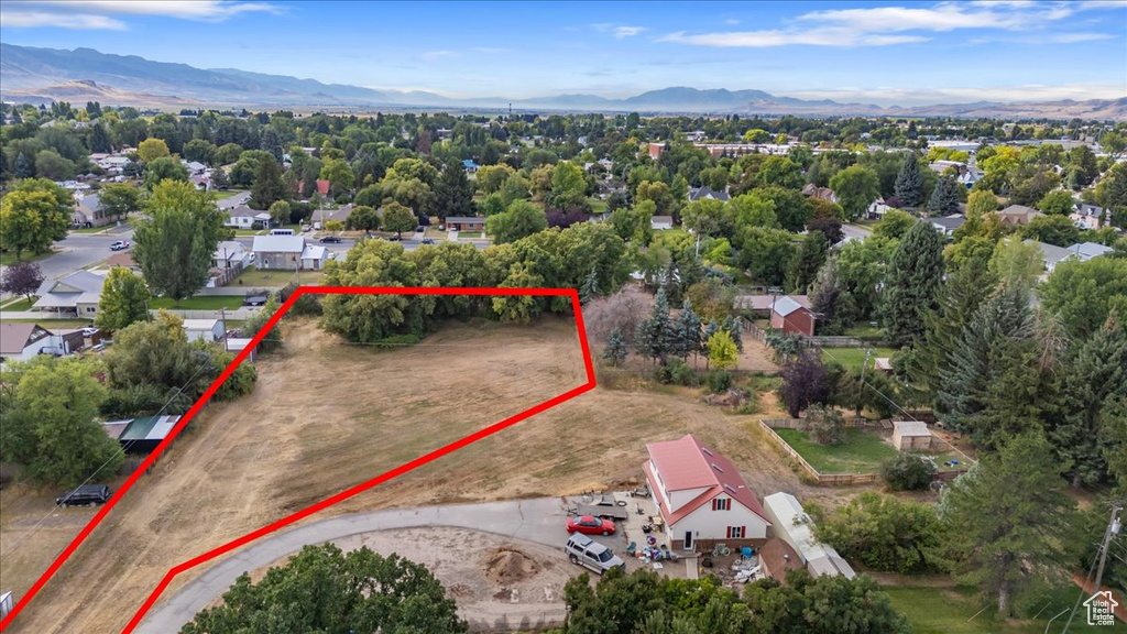 Aerial overview of property's location featuring mountains and property boundaries highlighted