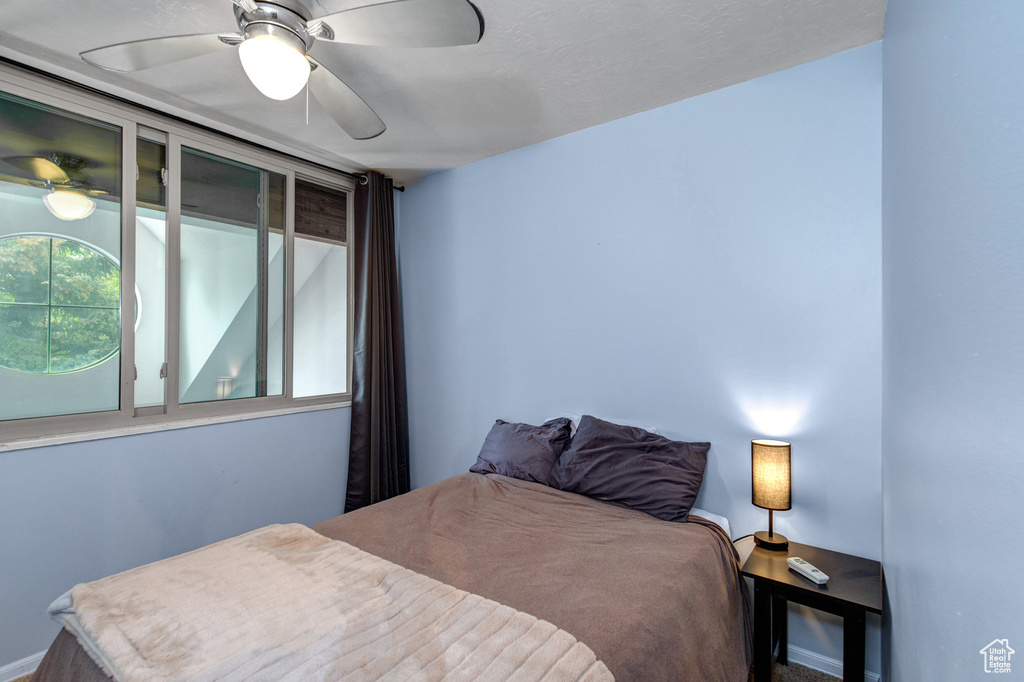 Bedroom featuring a ceiling fan