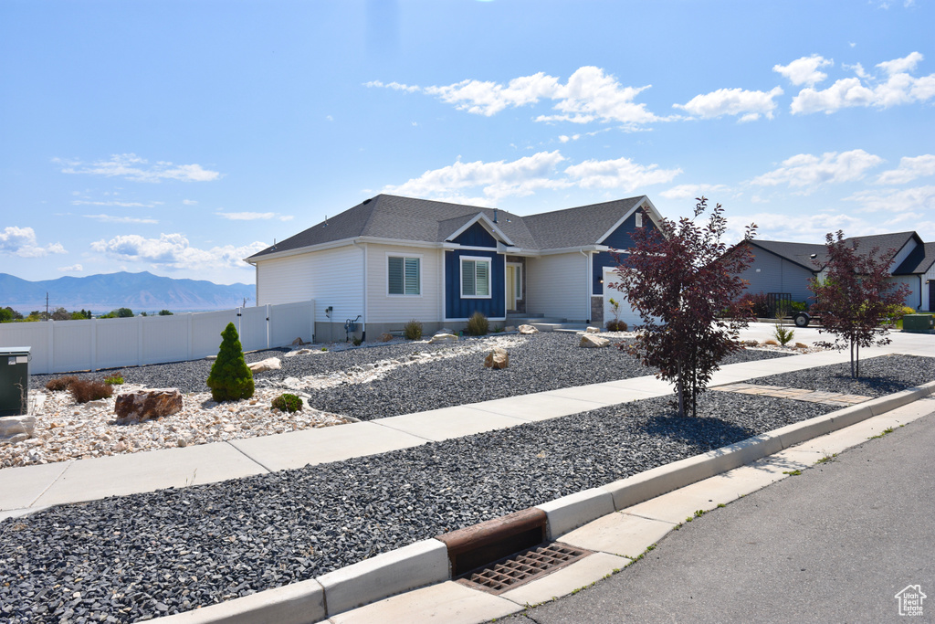 Ranch-style home with a mountain view and an attached garage
