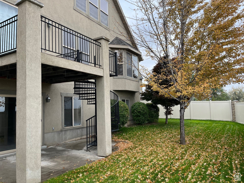 View of yard featuring stairway and a patio