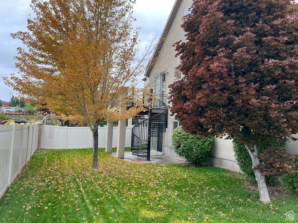 Fenced backyard with stairway