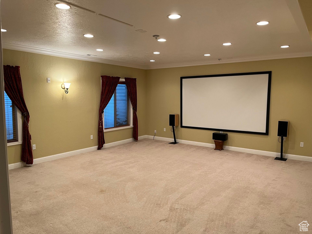 Home theater featuring ornamental molding, carpet flooring, and recessed lighting