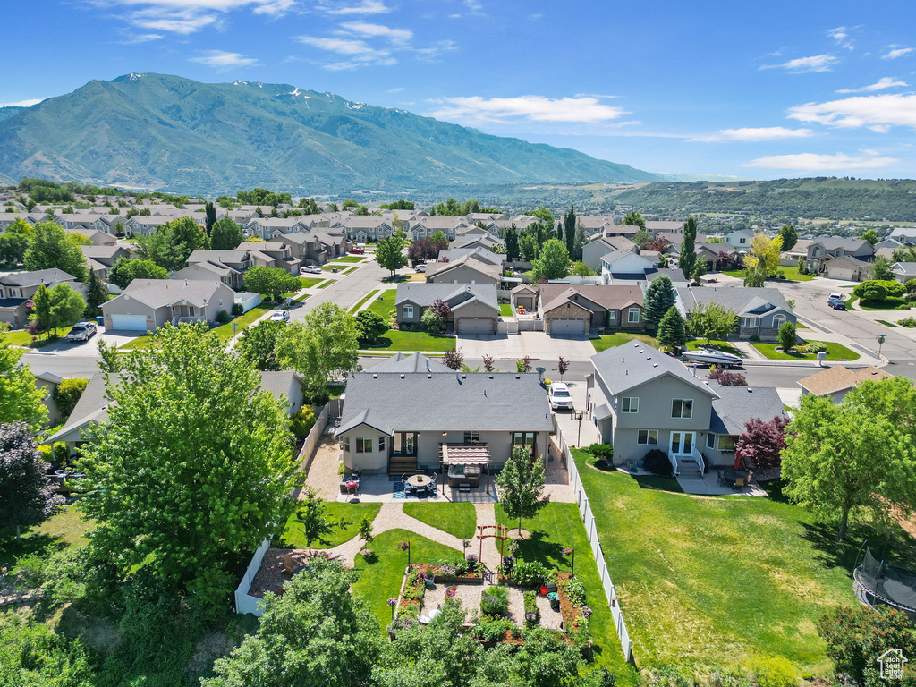 Aerial view of residential area featuring mountains