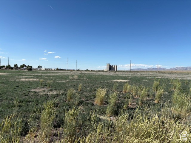 View of local wilderness featuring rural landscape and a mountain backdrop