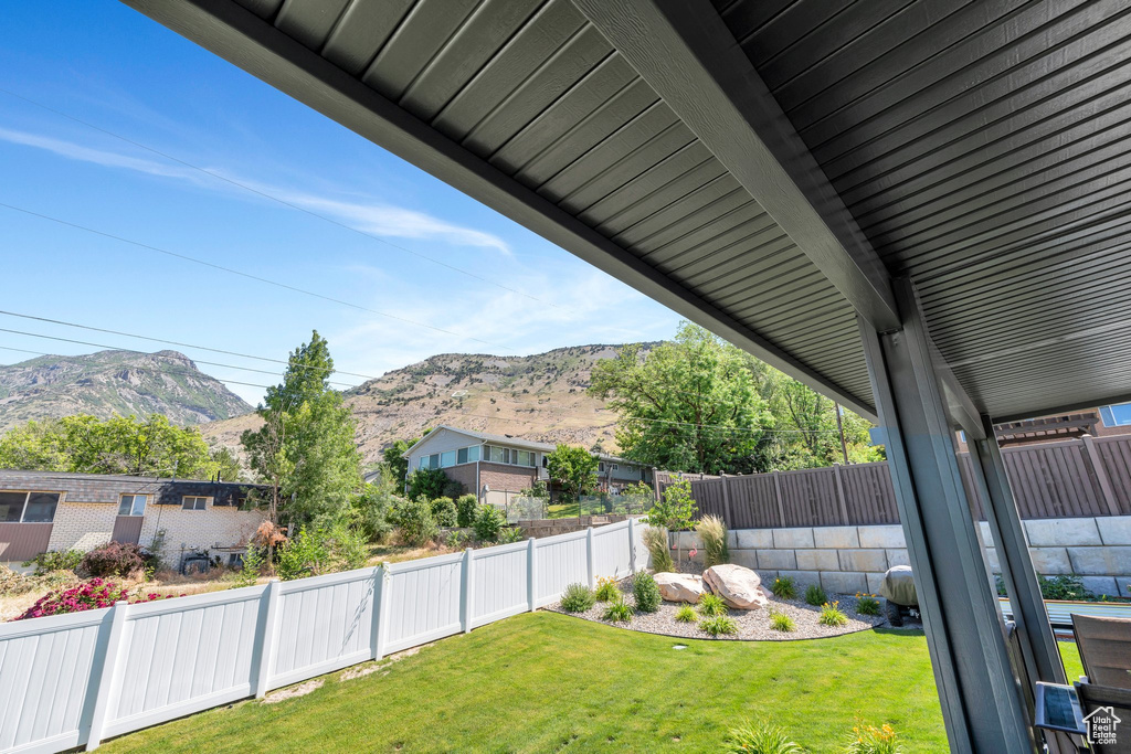 Fenced backyard with a mountain view