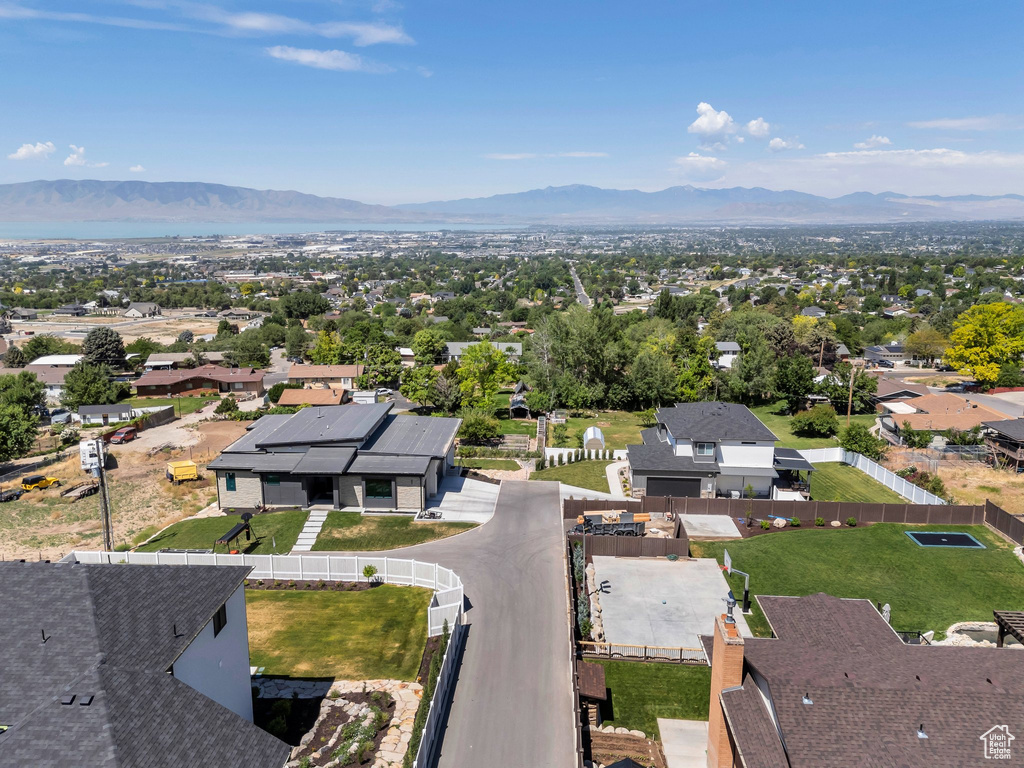 Aerial perspective of suburban area with a mountainous background