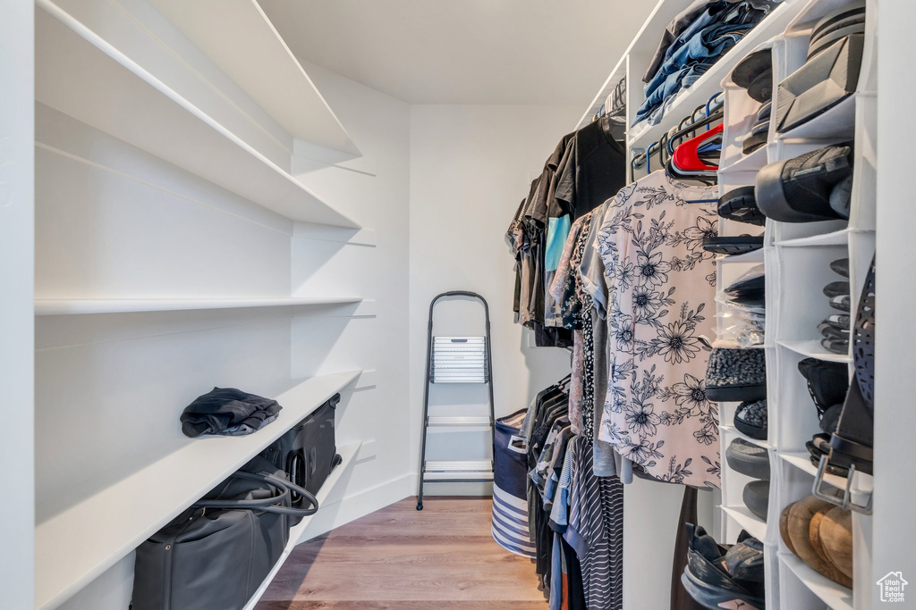 Spacious closet with wood finished floors