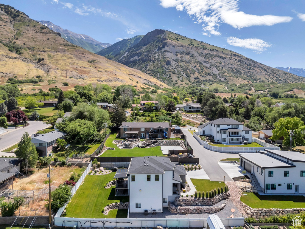 Aerial view of residential area featuring mountains