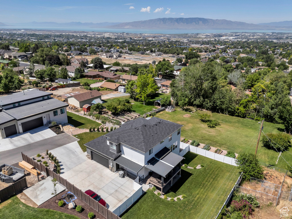 Aerial perspective of suburban area with a mountain backdrop