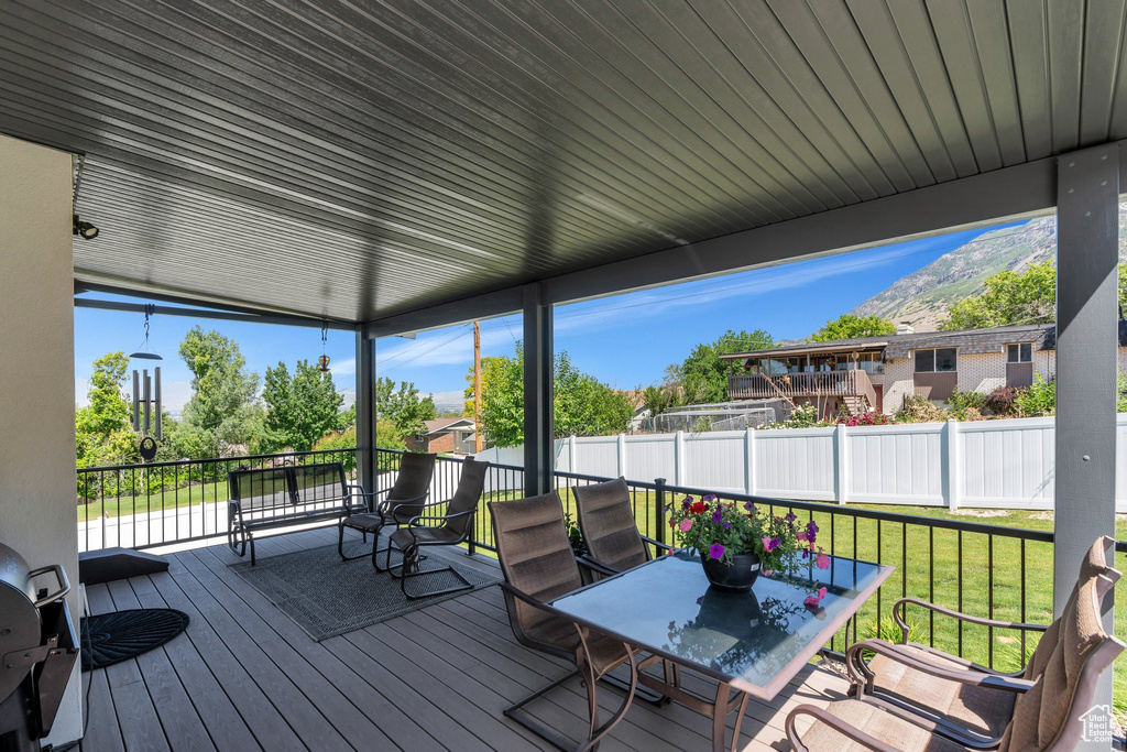Wooden terrace with outdoor dining area