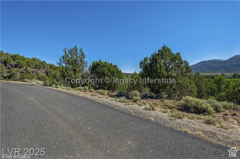 View of asphalt street with a mountain view