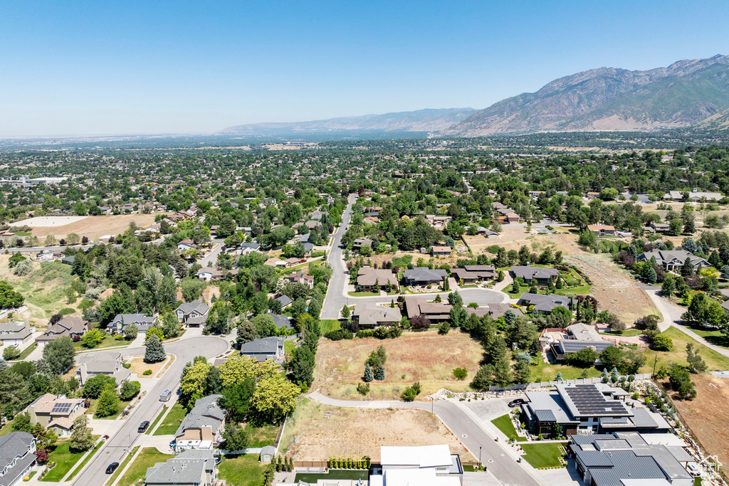 Aerial perspective of suburban area featuring a mountain backdrop