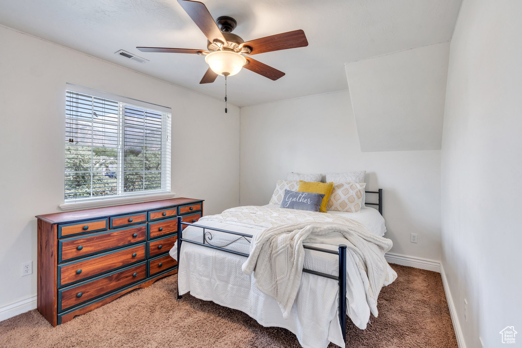 Bedroom with carpet flooring and a ceiling fan