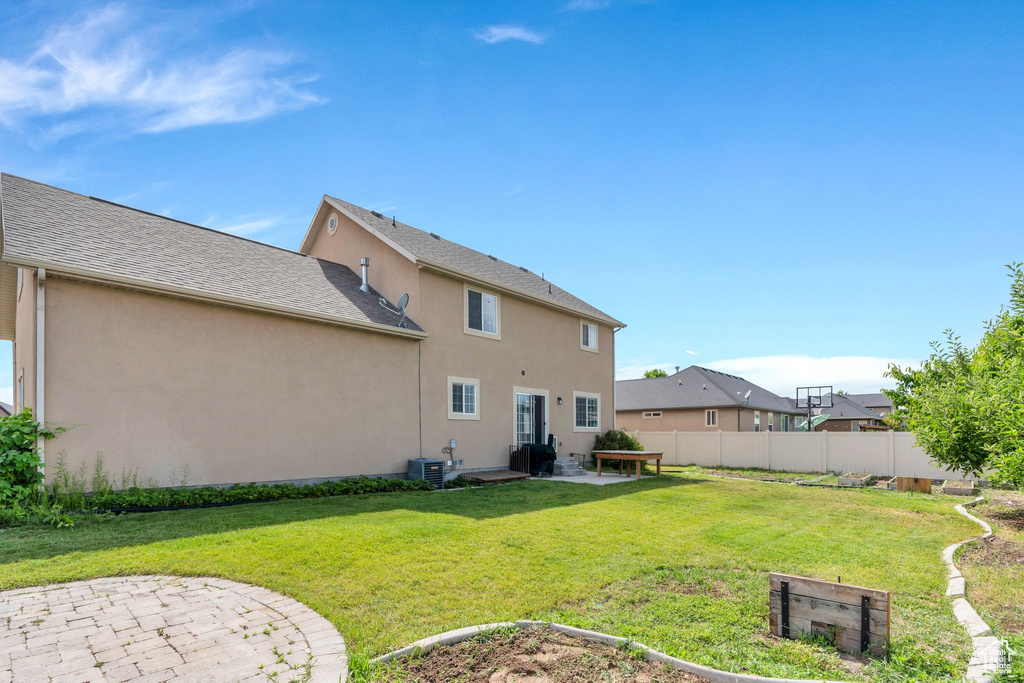 Rear view of property featuring stucco siding and a patio