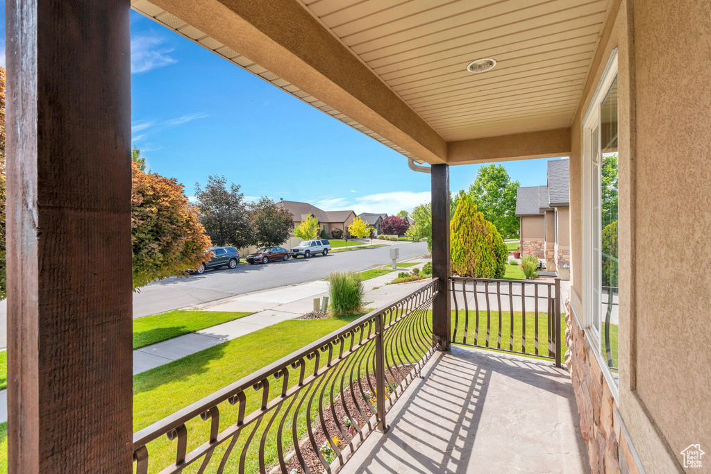 Covered porch with a residential view