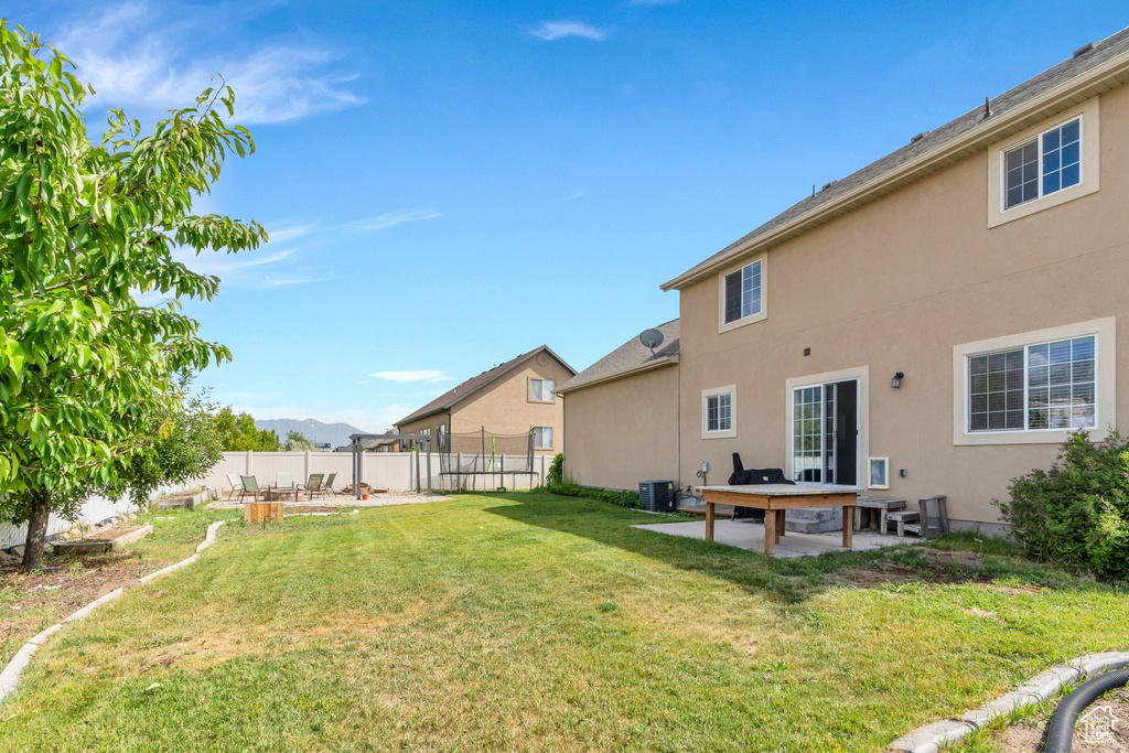 View of yard with a patio