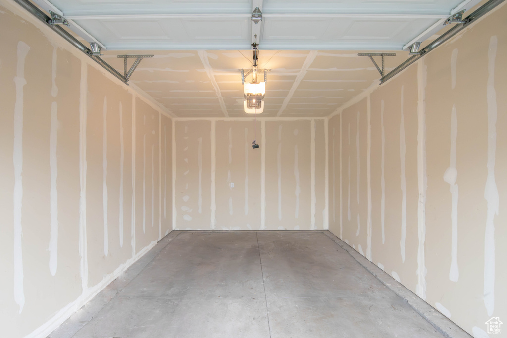 Garage featuring a garage door opener