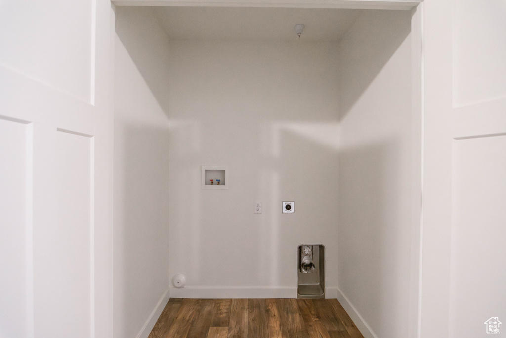 Washroom featuring washer hookup, dark wood-style floors, and electric dryer hookup