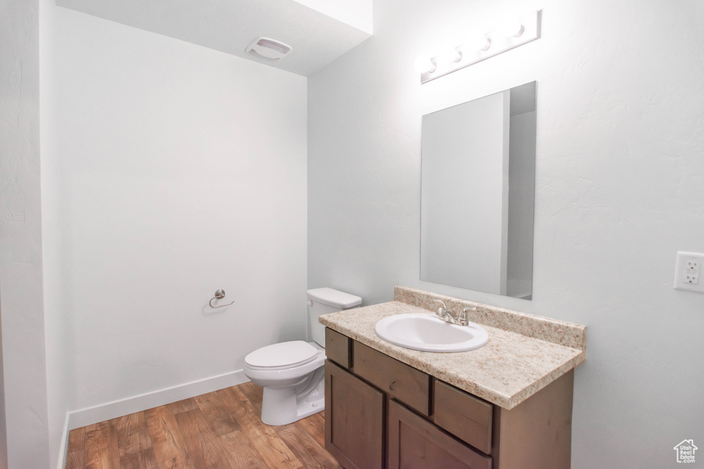 Bathroom with vanity and wood finished floors