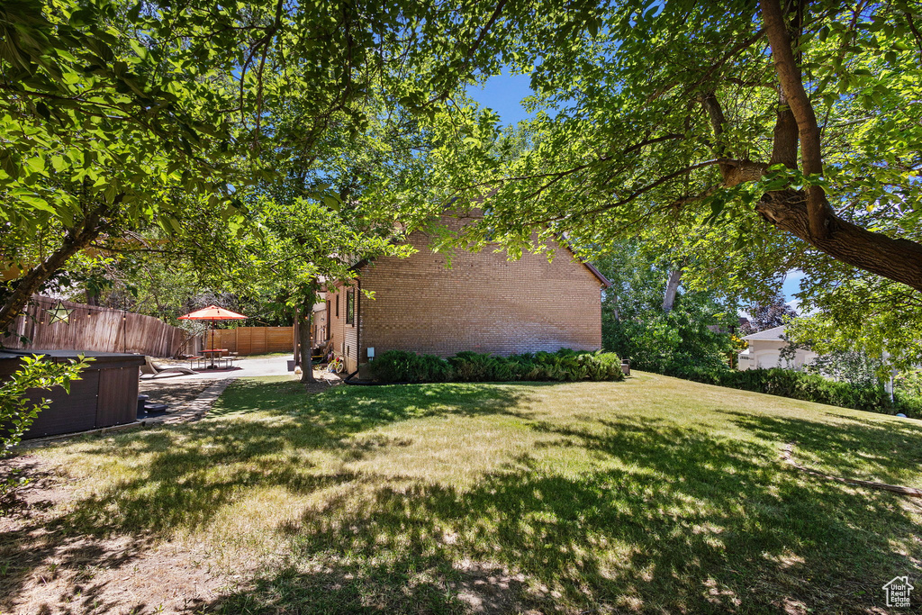 View of yard with a patio area