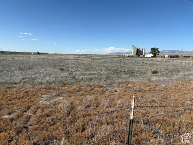 View of yard with a rural view