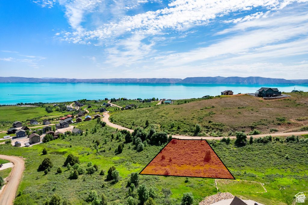 View of property location featuring a water and mountain view and property parcel outlined