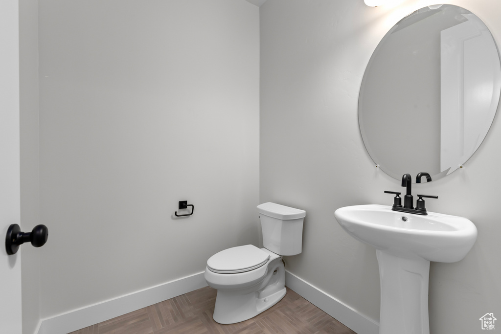 Bathroom with baseboards and toilet