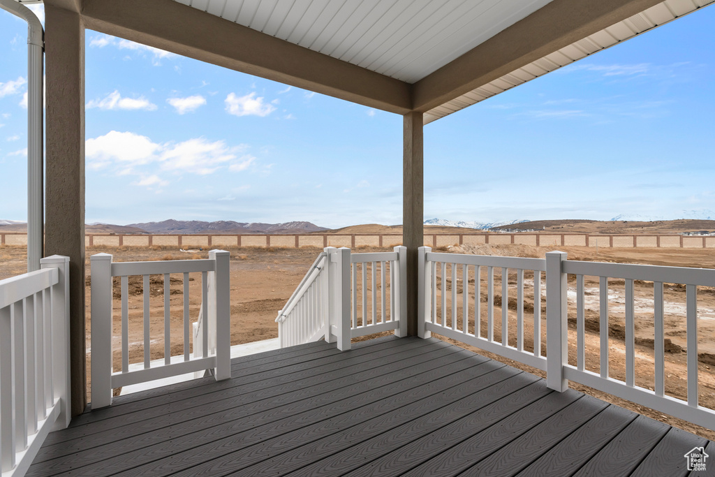 Wooden deck featuring a mountain view