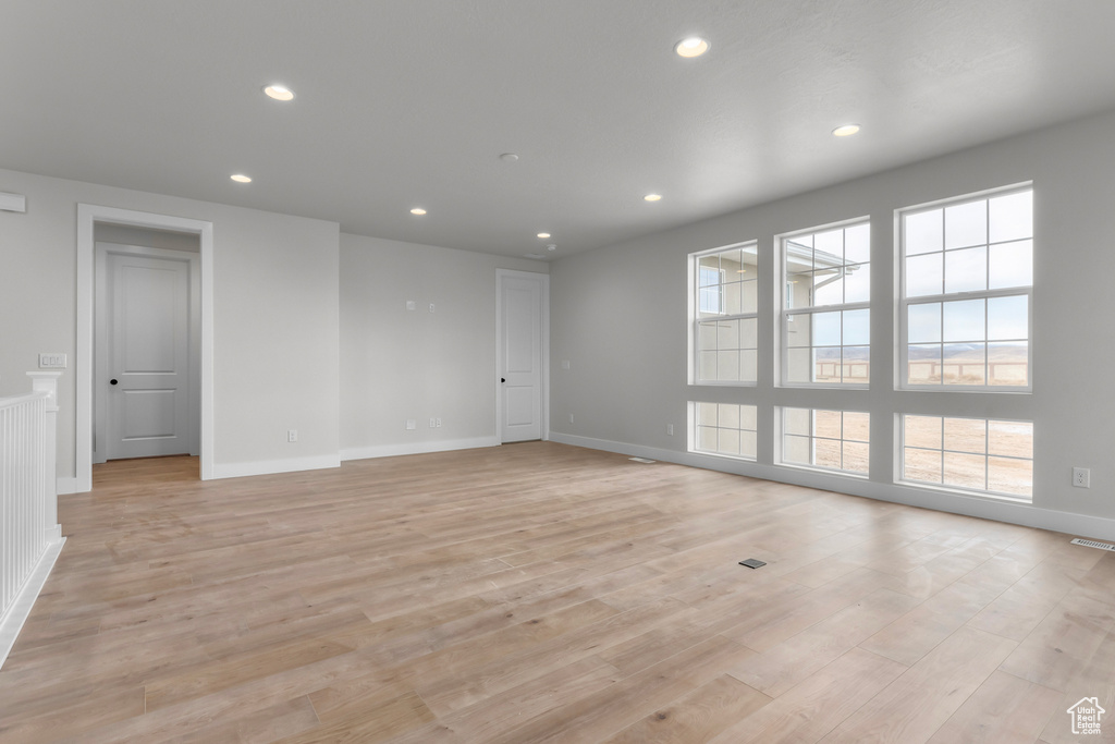 Unfurnished room featuring light wood-style floors and recessed lighting
